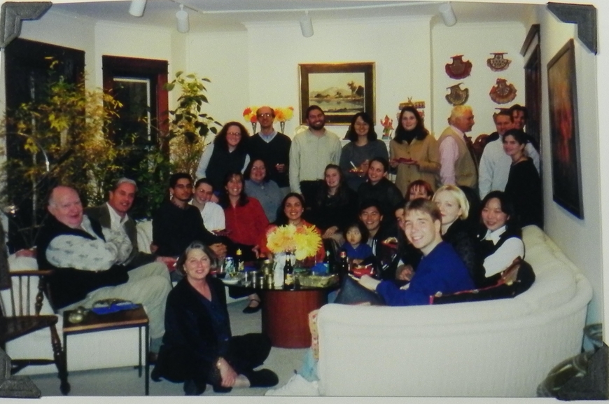Color photo of people at a party at the Asher's home