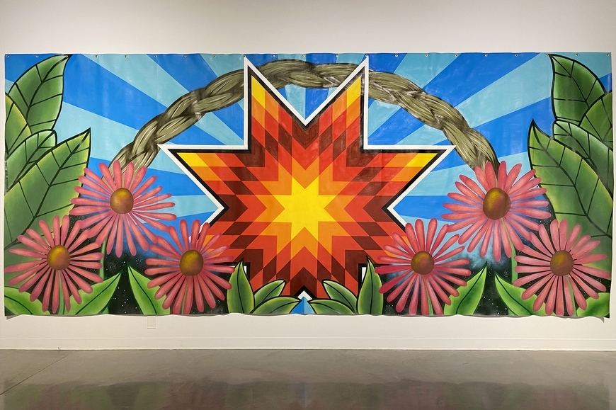 Large scale mural with a central eight pointed star surrounded by flowers and an arc of braided sweetgrass.
