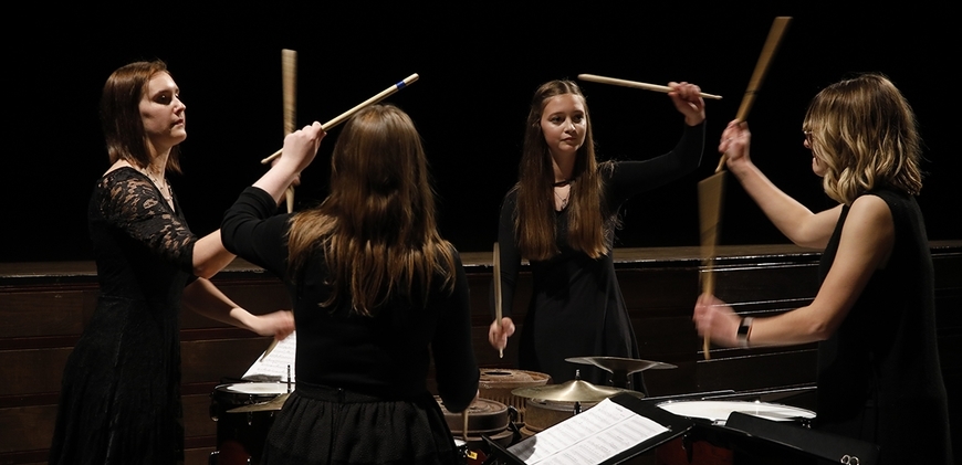 An all-female group of Percussion Ensemble members Perform on the Marimba. 