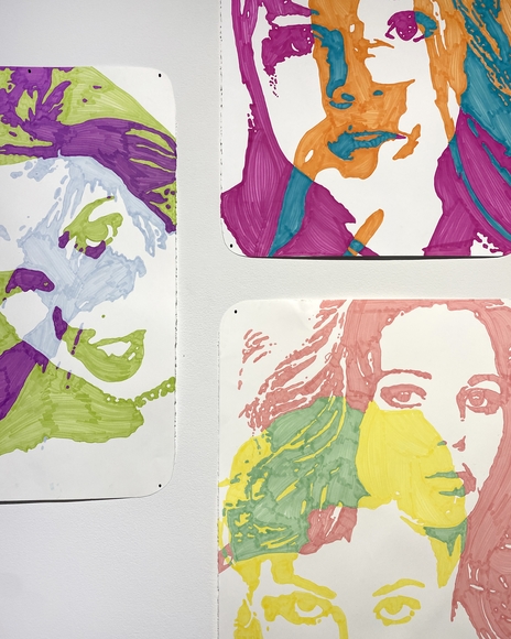 Three multicolor marker drawings of overlapping female faces
