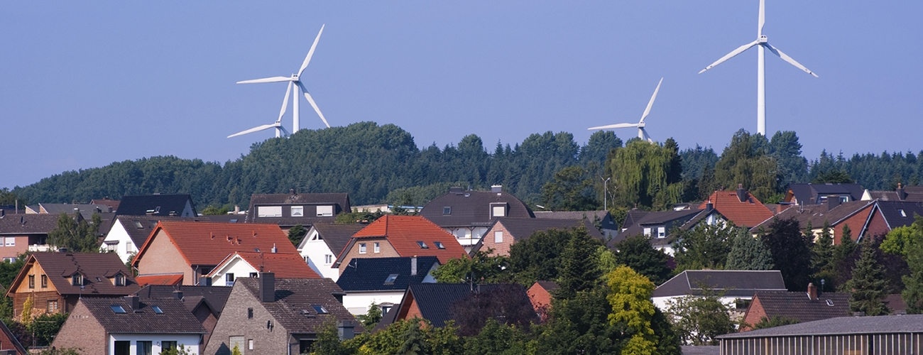 Photo of windmills in a German town, with houses in the foreground