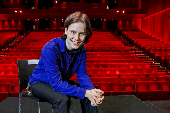 Picture of Colin Covert in front of a stage 