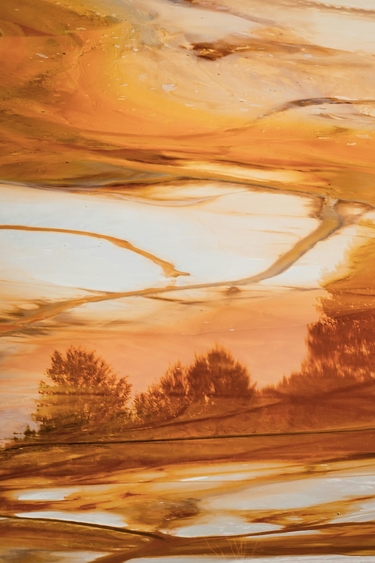 Orange painting of a lake and trees