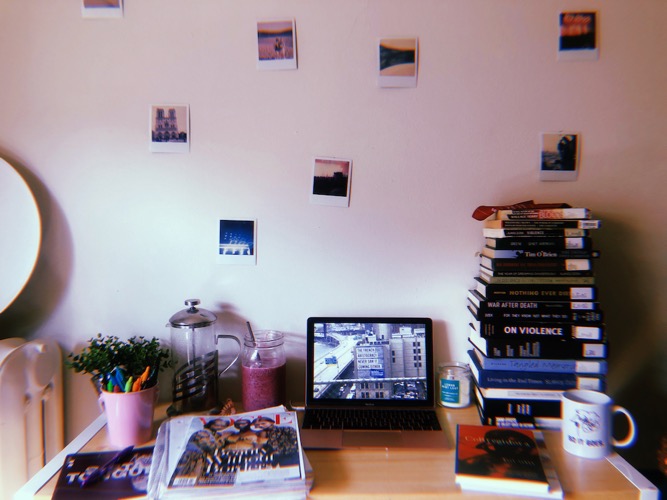 Photo of Kerstin Tuttle's office set up, with Poloroid photos on the wall