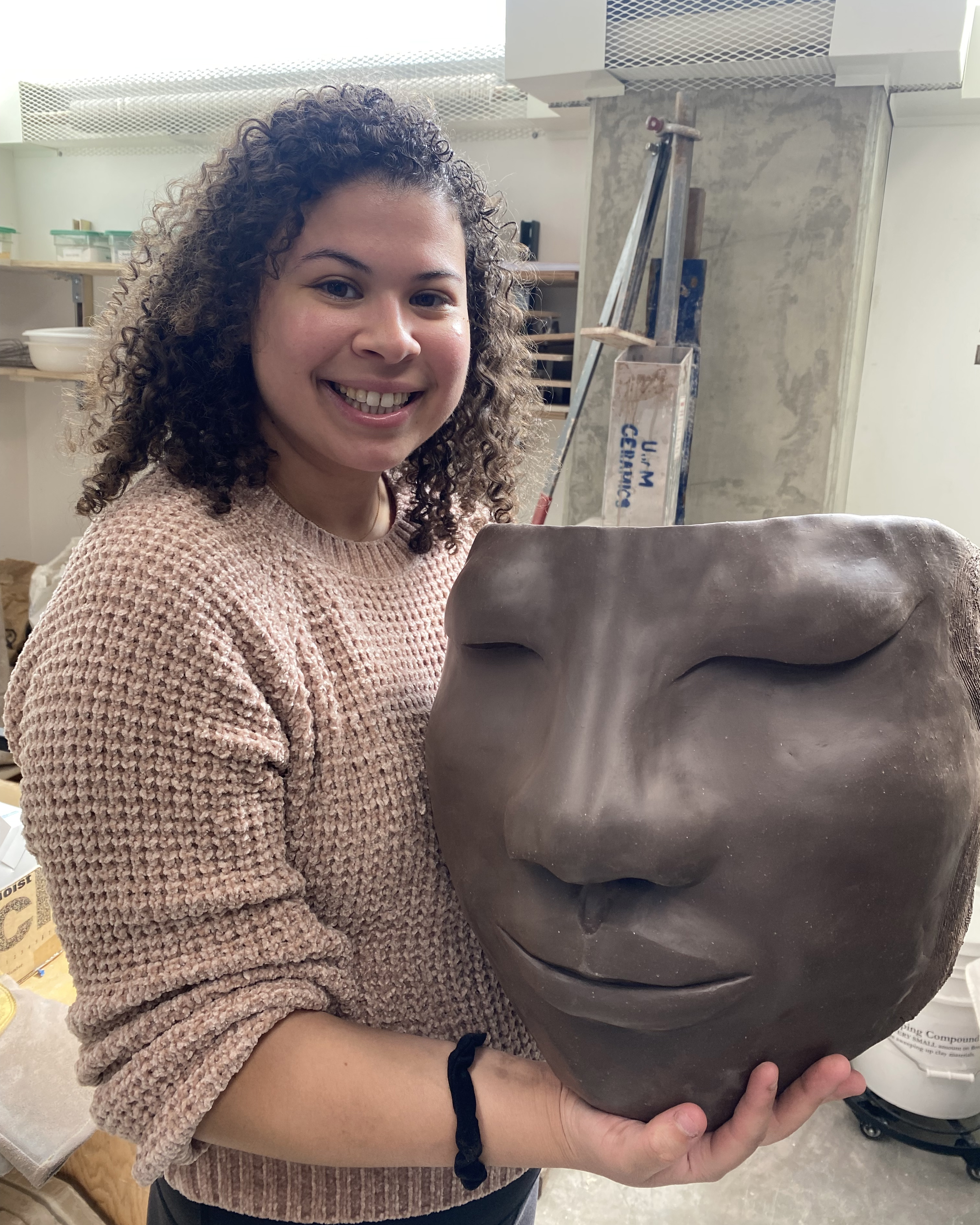 Maya Jackson with her face-shaped clay planter
