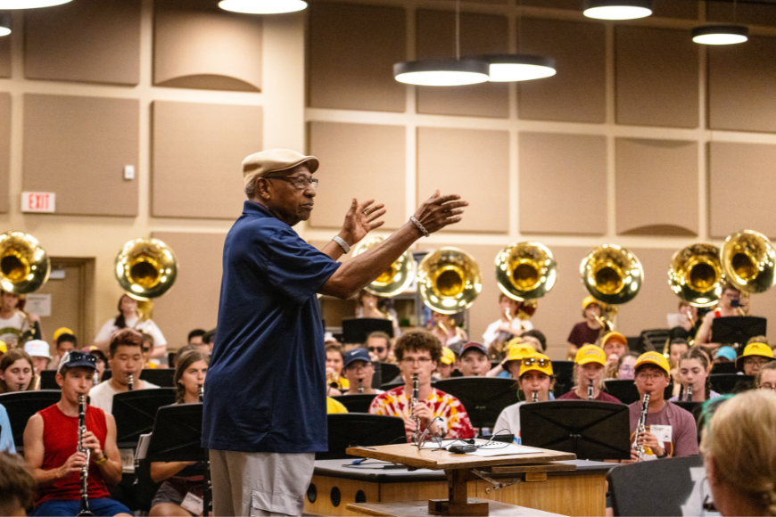O'Neill Sanford rehearses with the marching band during his September visit.