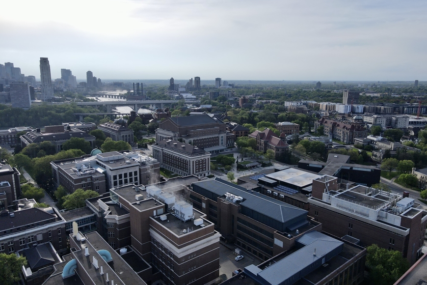 Aerial shot of East Bank Campus with downtown in background, UMN Twin Cities
