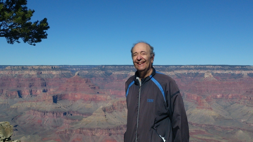 Elliot Rothenberg standing in front of the Grand Canyon