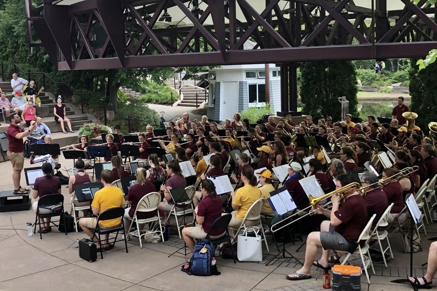 UMBAS Concert Band performing at an outdoor venue.