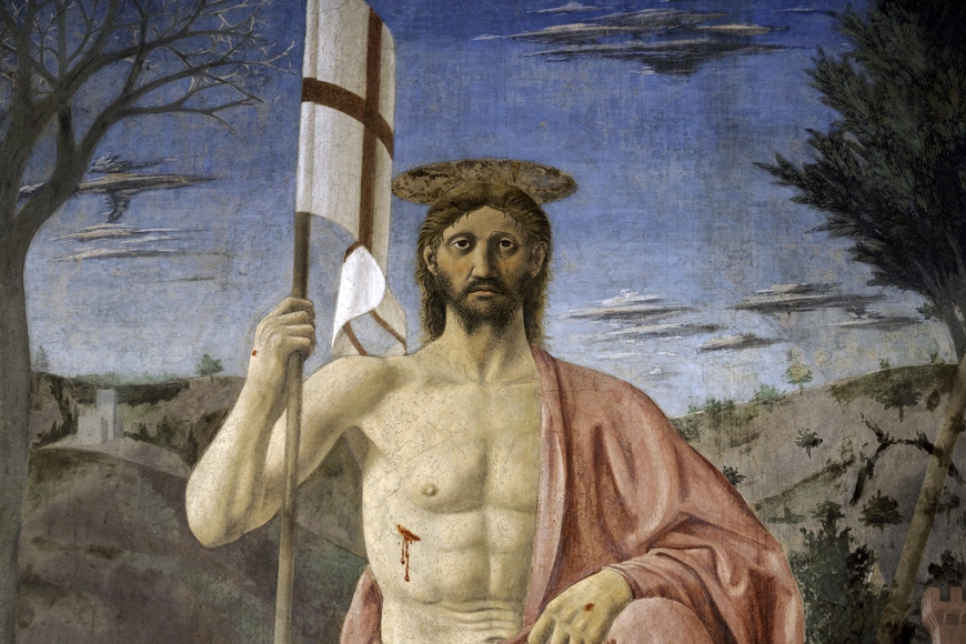 15th-century fresco of Jesus, outside, with side wound holding an Italian flag