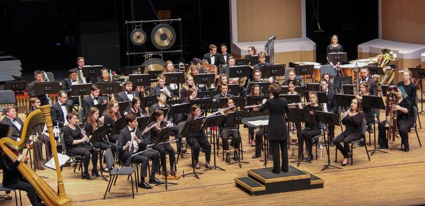 University Wind Ensemble playing on stage during a concert