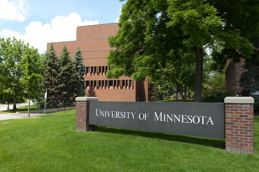 Elliot Hall exterior with a University of Minnesota sign in the foreground