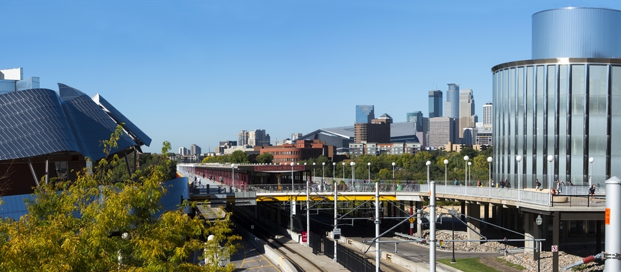 Panorama of Washington Avenue bridge in foreground, downtown Minneapolis in the background