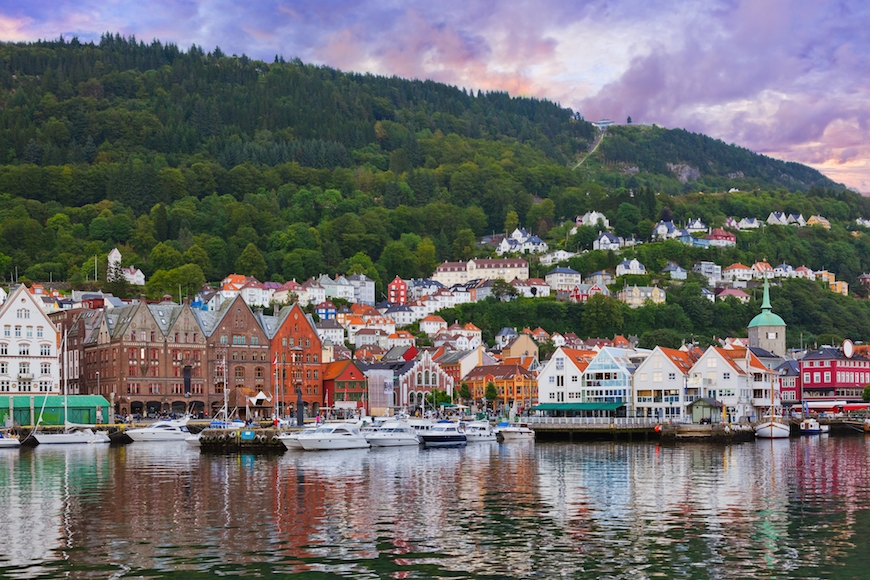 Colorful houses on a hill over water in the daytime in Bergen, Norway
