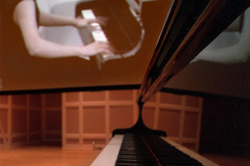 Pianist hands at keyboard