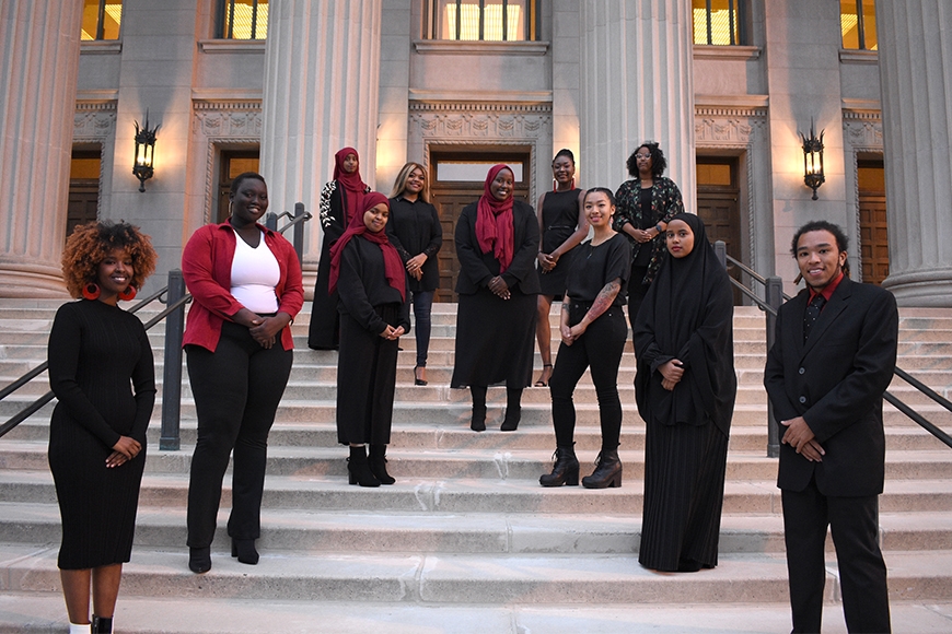 A group of members of the Association for Black Psychology Students standing on the steps of Northrop on the Twin Cities campus