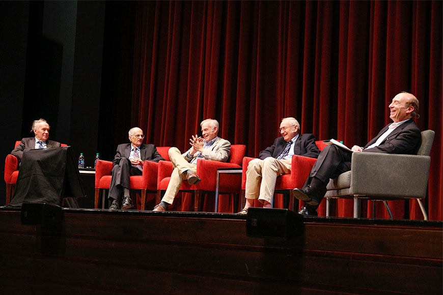 (left to right) Edward C. Prescott, Thomas J. Sargent, Christopher A. Sims, Neil Wallace with moderator Art Rolnick on stage at the Ted Mann Concert Hall.