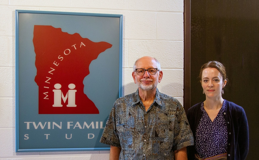 Keven Haroian and Rachel Hawley standing in front of the Minnesota Twin and Family Sign
