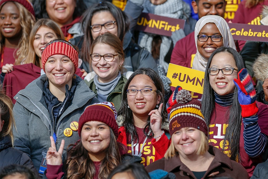 Group photo of diverse young women wearing University of Minnesota clothes