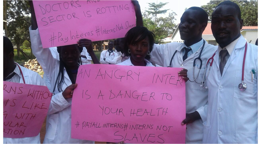 university of medicine faculty holding protest sign 