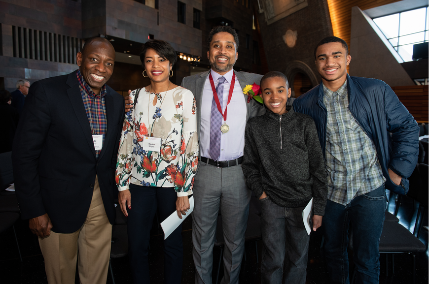  Featured in the photo are Professor Mayes and his family, and Professor Okediji.