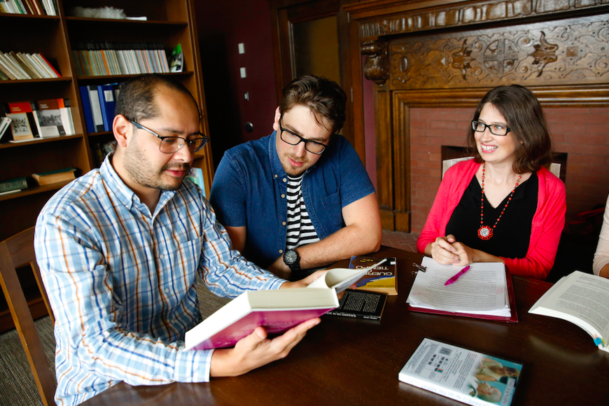 grad students working in library