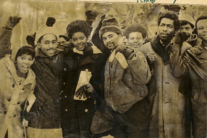 Photo from 1969 takeover of Morrill Hall of Black students celebrating. They are wearing winter clothing.