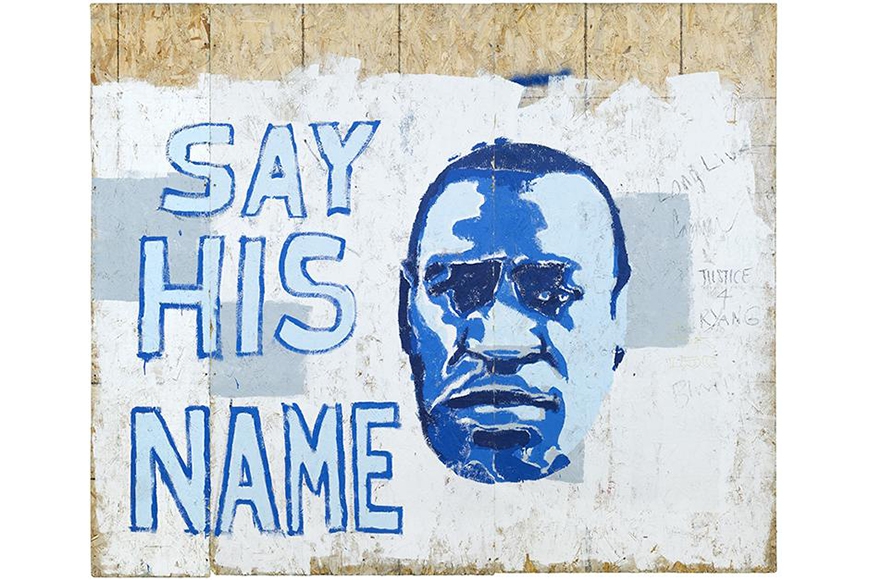  A monochromatic blue painted portrait of George Floyd juxtaposed next to text reading “SAY HIS NAME” sits on a white paint rolled background on plywood.