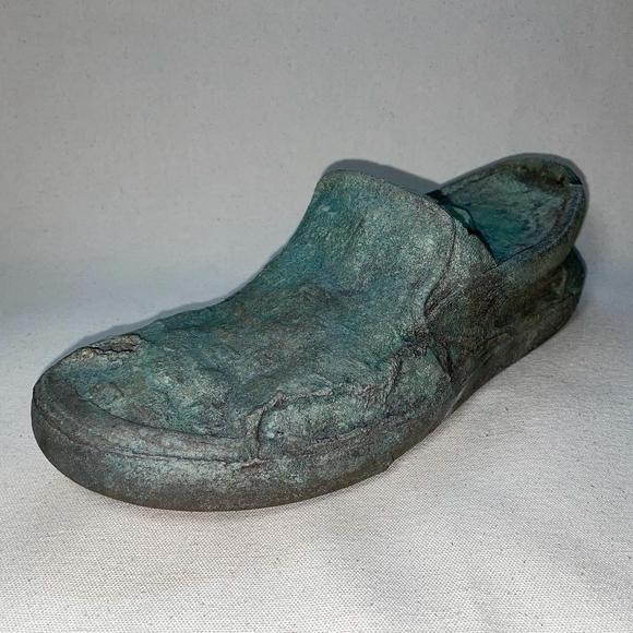 Foreshortened angle of a cast bronze loafer