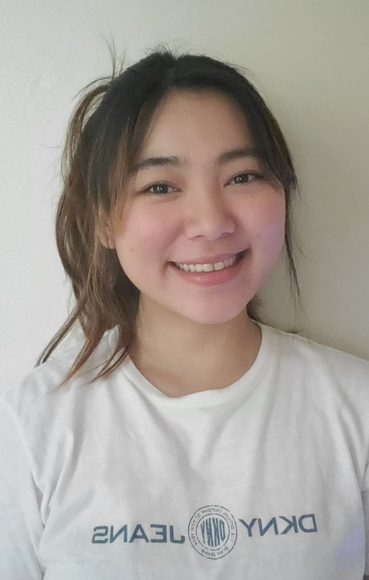 Photo of Zoe Nguyen wearing a white t-shirt 