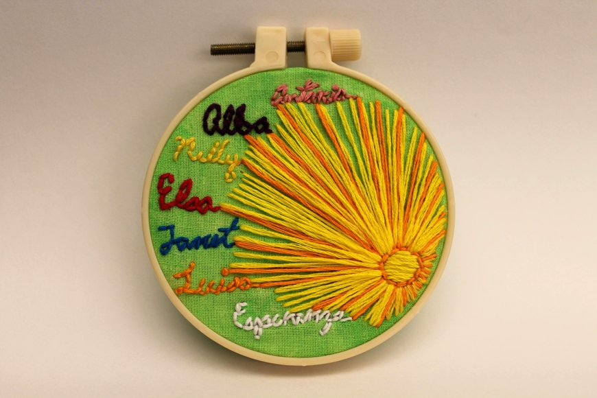 Embroidered image of sun with words from the Testimonies of Hope workshop