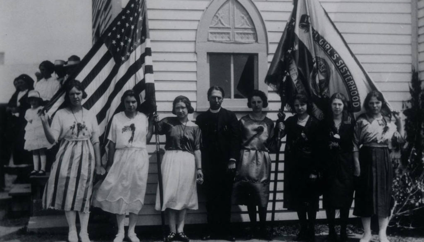 Black and white image of Ukrainian sisterhood holding flags in Wilton, North Dakota