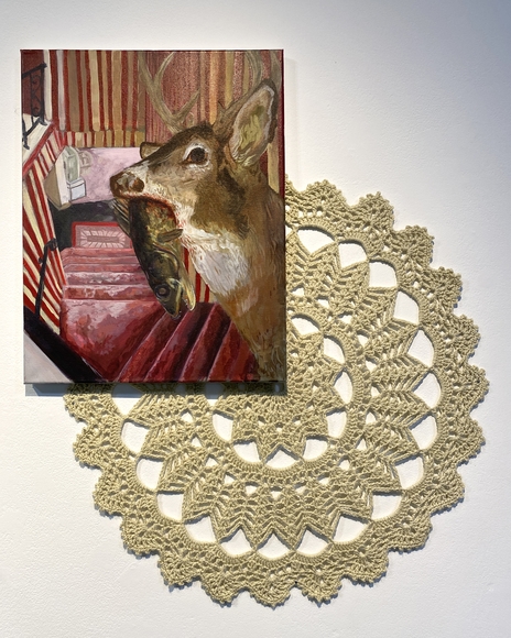 Painting of a deer eating a fish, hanging on a wall with a beige doily