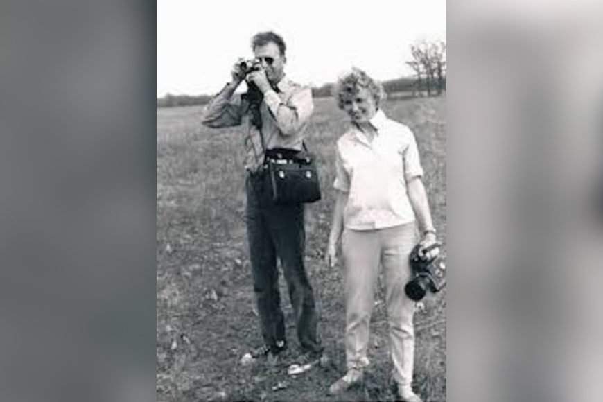 Professor Luther Gerlach and his wife Ursula in a photo taken in the late 1956. He is holding up a camera, ready to take a picture.