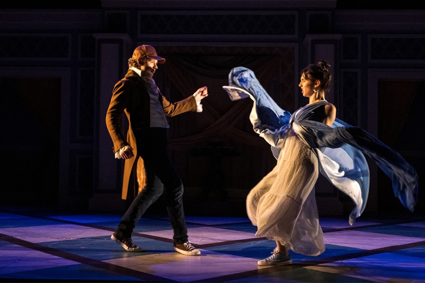 Mr. Bingley and Jane dance, with a dark background
