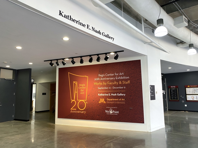 Red banner outside the Katherine E. Nash Gallery advertising the 20th Anniversary exhibition
