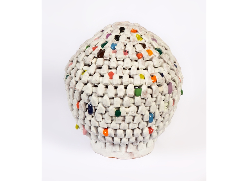 A white ceramic vessel with intermittent colored beads