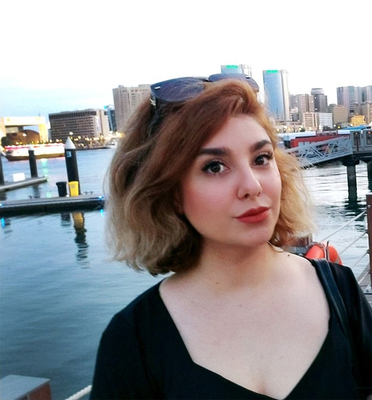 Roya Nazari Najafabadi in front of a harbor