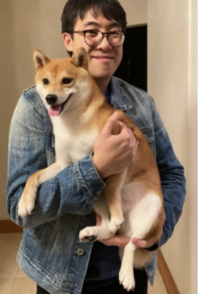 Picture of Richard Lim, a man with glasses holding a dog