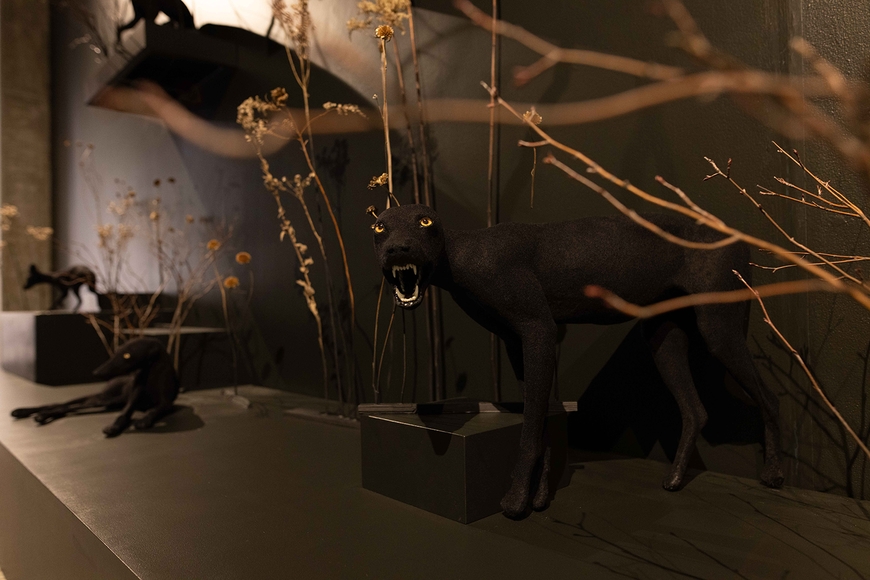 Sculpture of a black dog against a black wall by Taylor Johnson MFA 2022