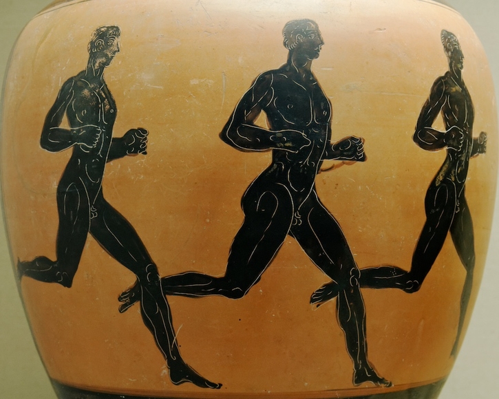 Tan ceramic vessel from the ancient world painted with three runners in black