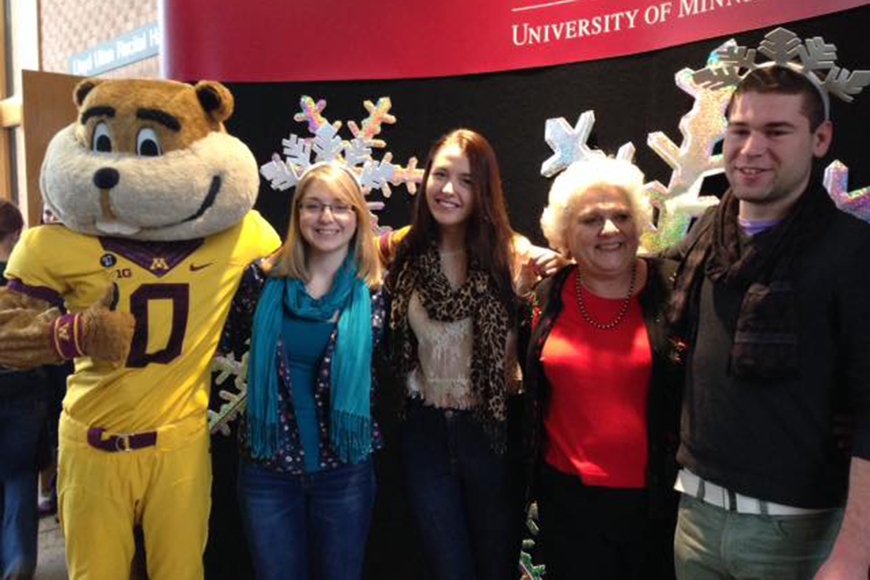 Jean del Santo with three of her students and Goldy Gopher on the left 
