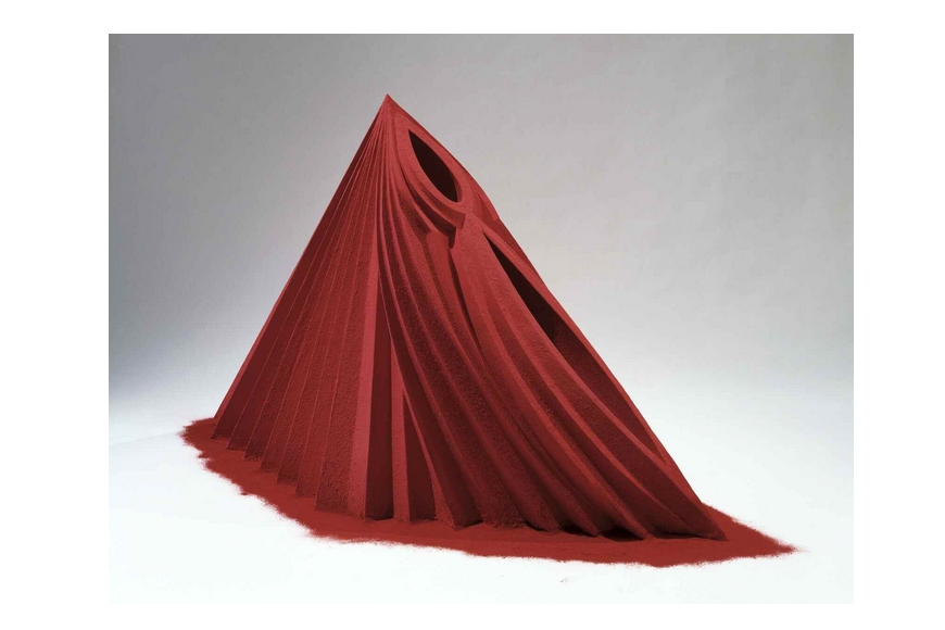 A red installation sculpture, a mountain made of dust