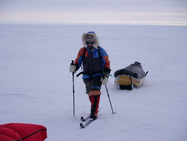 Man pulling sled in Antarctic