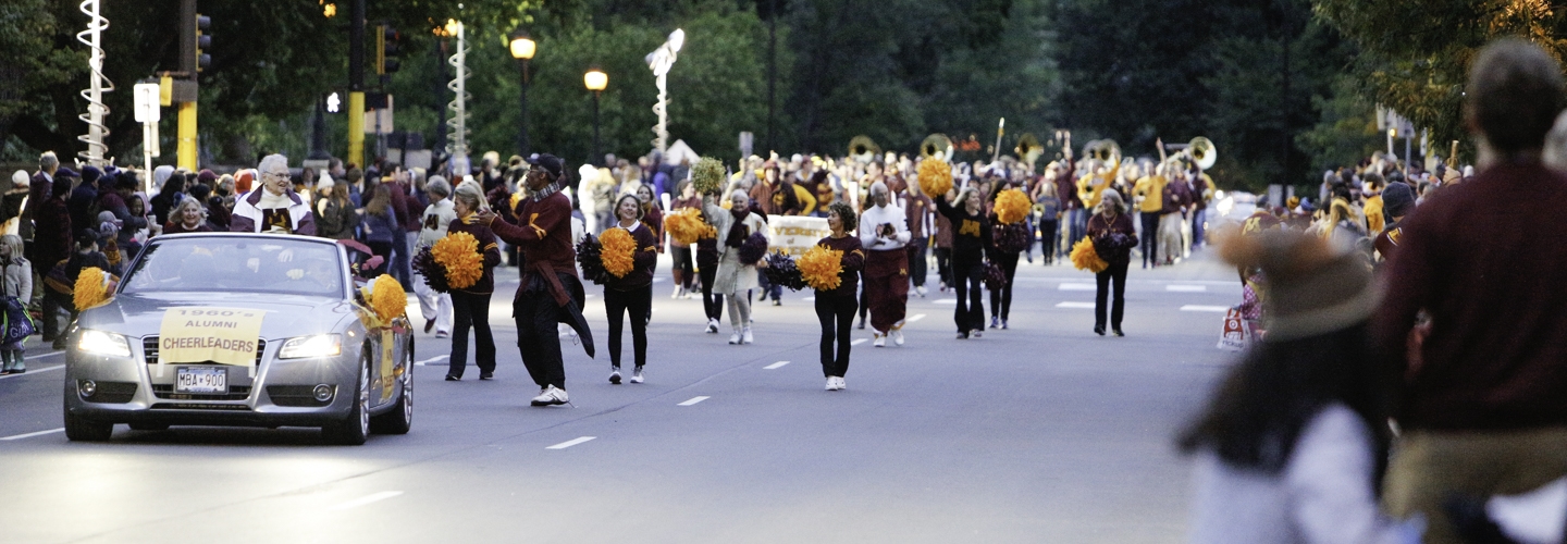 Image of alumni band marching in homecoming parade
