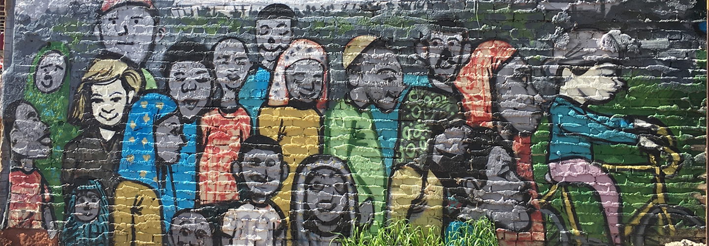 Multicultural mural on brick wall, Cedar Riverside
