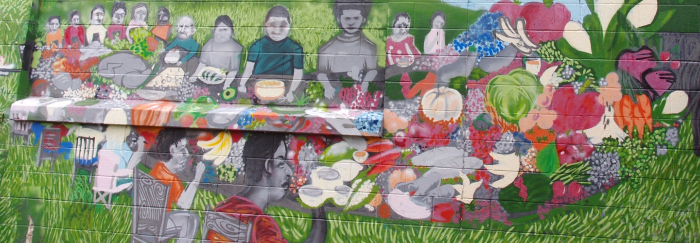 mural of people sitting at table and flowers
