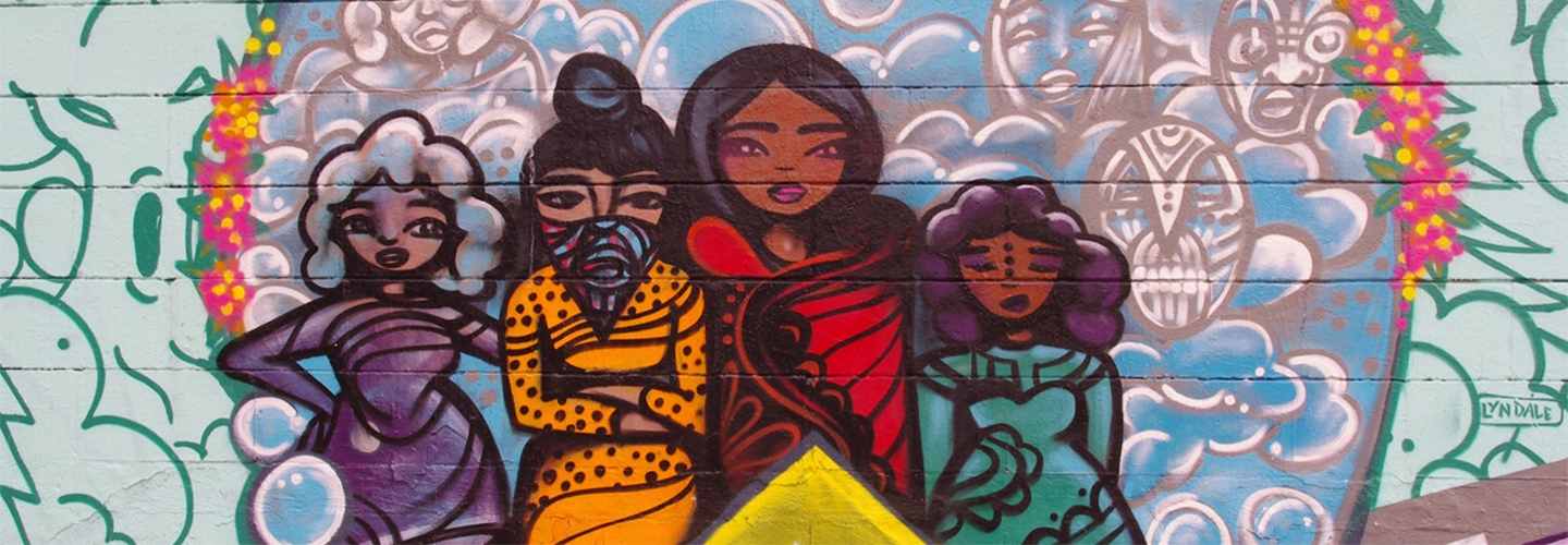 Colorful mural of three youth