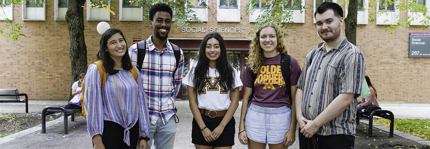 Five polisci students in front of the Social Sciences building