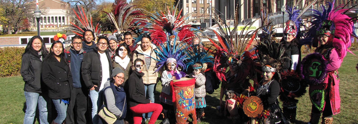 Dancers in costume and other community members for a Dia De Los Muertos event
